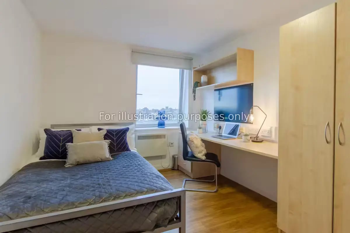 Bed desk wardrobe with laptop and television bedroom at The Glasshouse in Nottingham Student Accommodation
