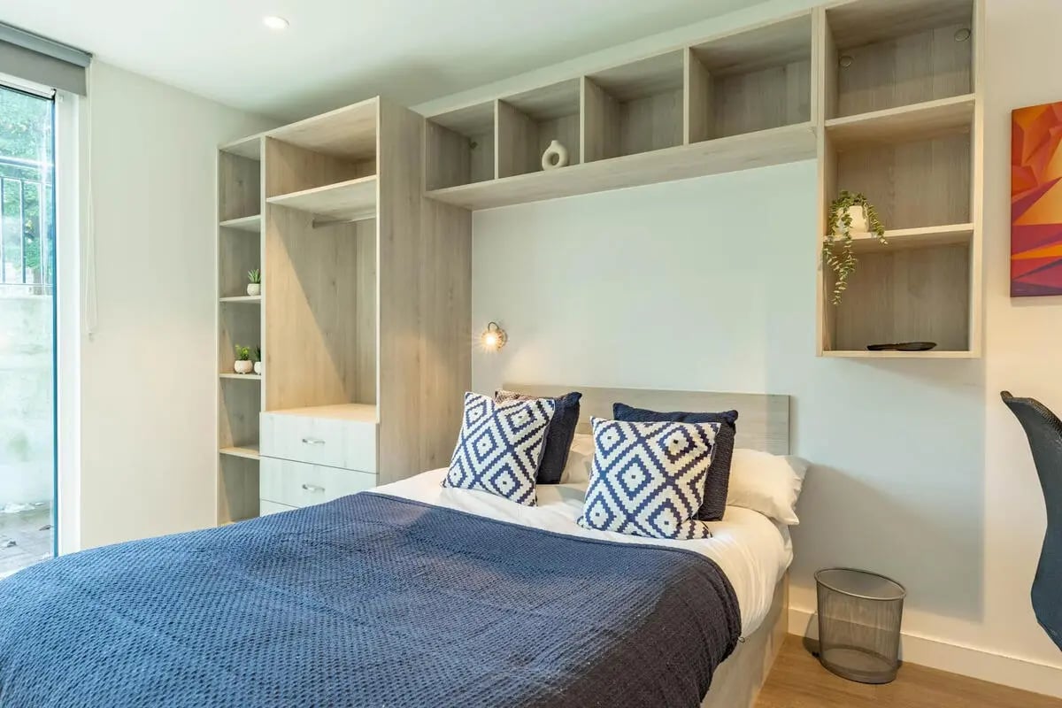 Bed pillows and shelves above bed Bedroom at Abeleven in Aberdeen Student Accommodation