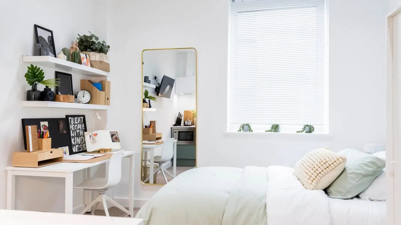 Desk shelves mirror bed bedroom at Aire in Stoke-On-Trent Student Accommodation