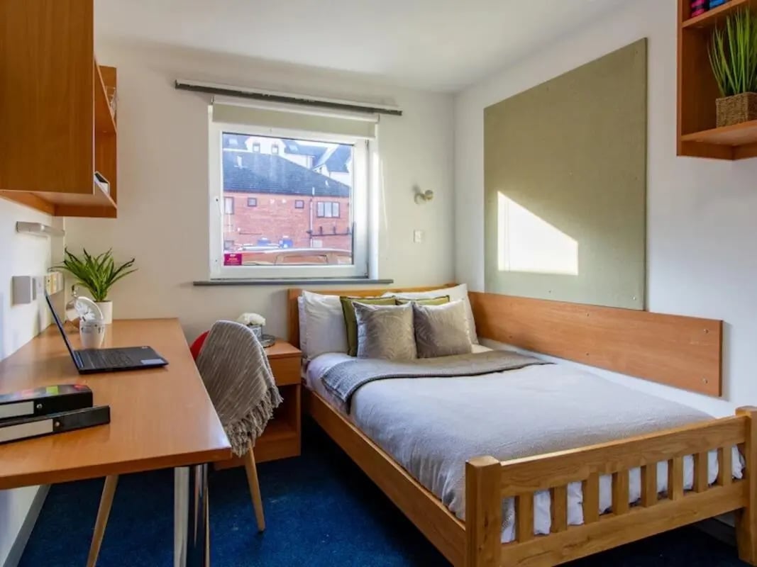 Bed desk chair and laptop bedroom at The Print House in Loughborough Student Accommodation