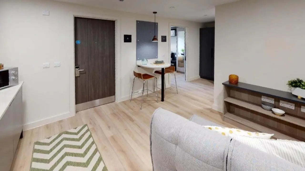 Microwave counter high table chairs sofa living room at Stanley Studios in Southampton Student Accommodation