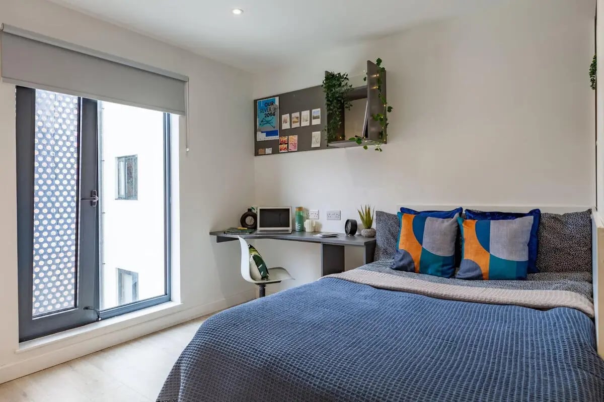 Bed desk chair and window Bedroom at Medici in Nottingham Student Accommodation
