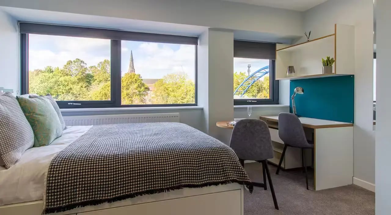 Bed desks chairs and shelves bedroom at Urban Student Village in Coventry Student Accommodation