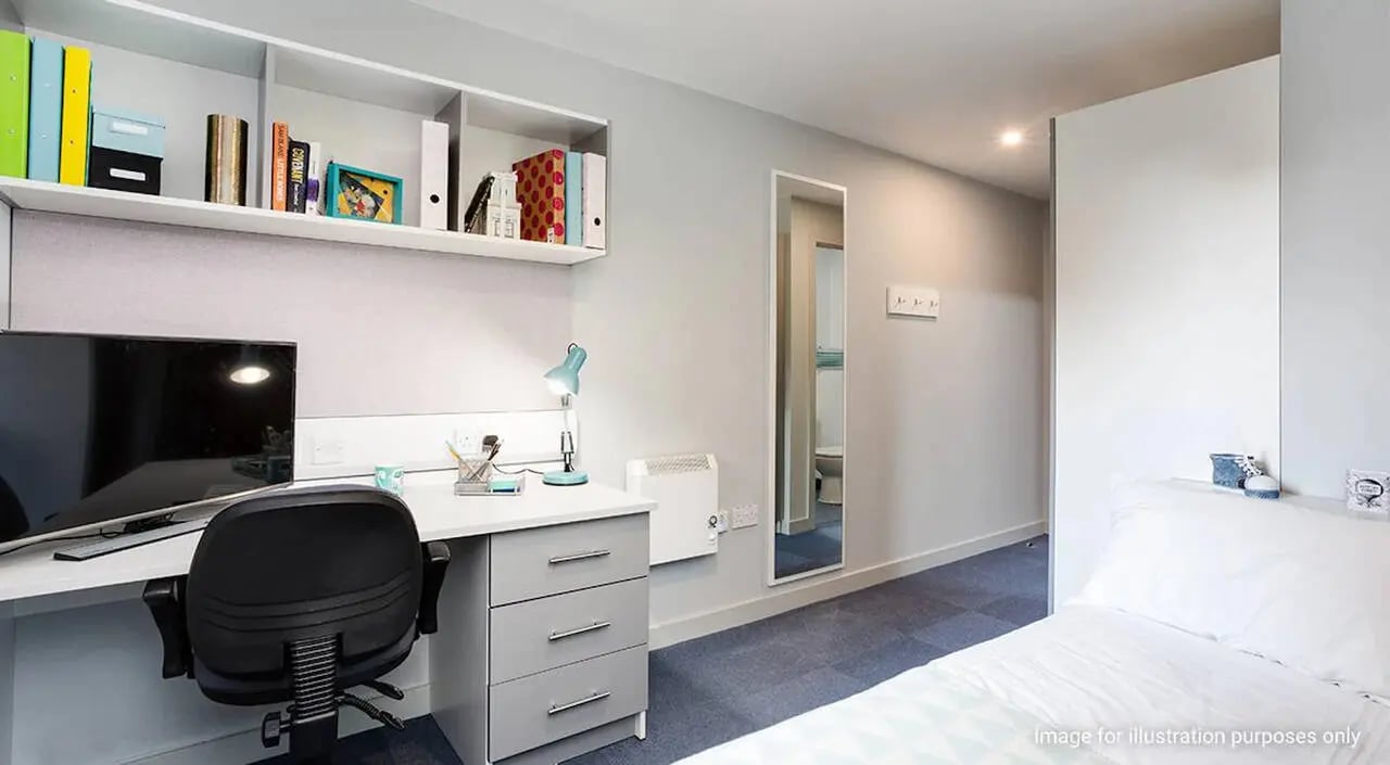 Desk lamp, TV, chair, shelves, bed bedroom at The Tramshed in Preston Student Accommodation