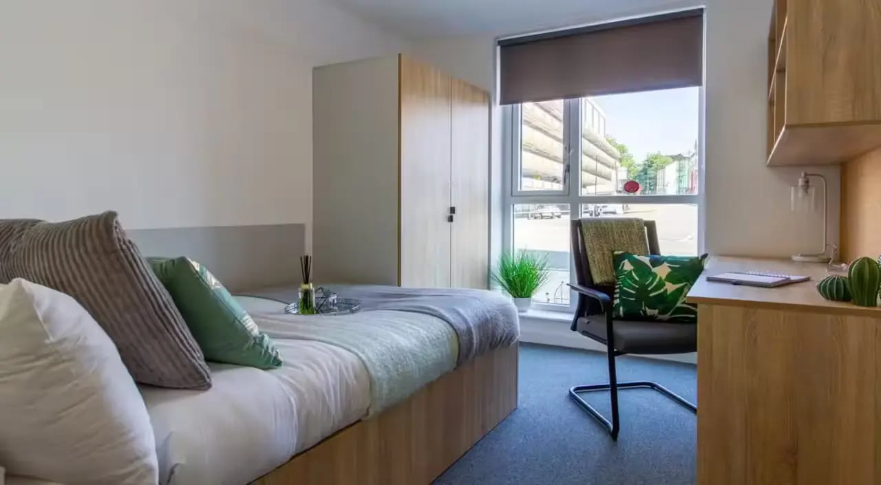 Bed desk wardrobe with window bedroom at The Croft in Derby Student Accommodation