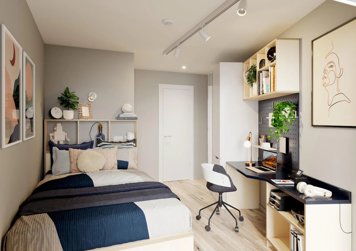 Bed desk chair shelves with plants and artwork bedroom at Silk Mill Edinburgh in Edinburgh Student Accommodation