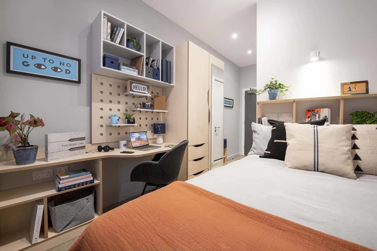 Desk wardrobe bed and shelves bedroom interior at Hillside House Sheffield in Sheffield Student Accommodation