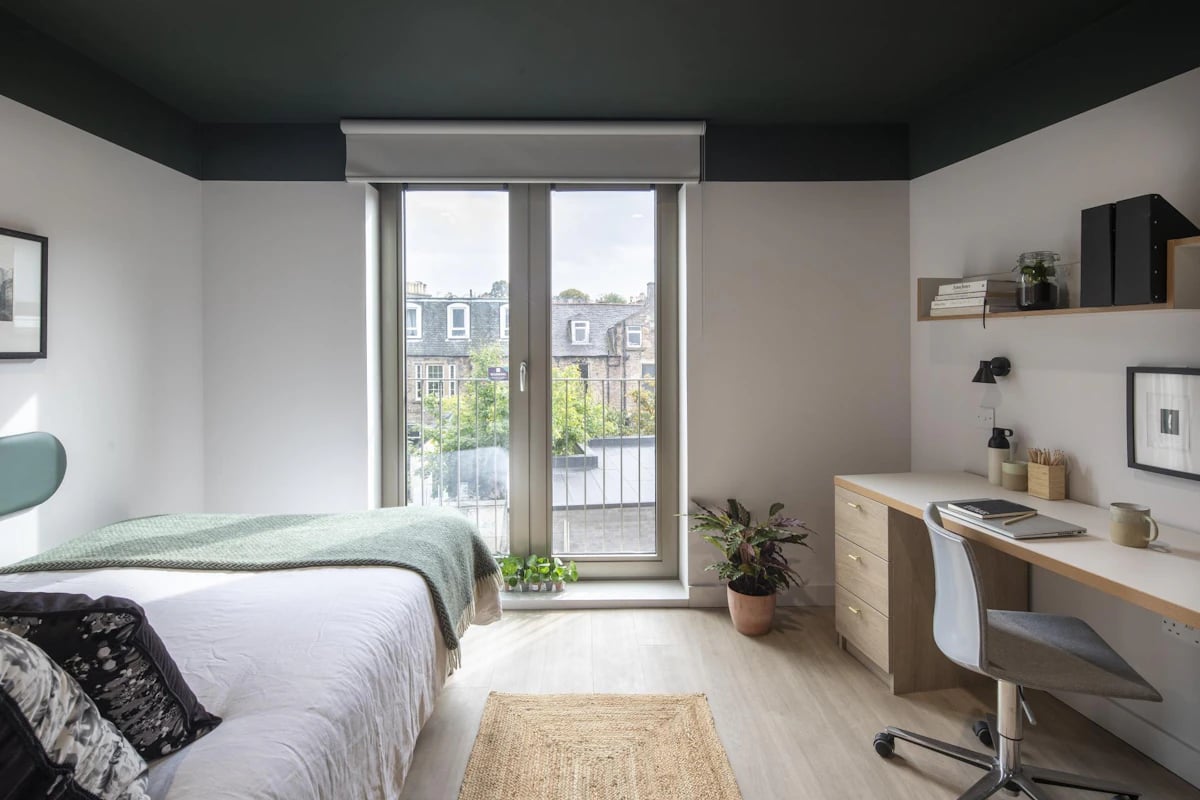 Bed desk plants and window bedroom at The Keel Houses in Edinburgh Student Accommodation