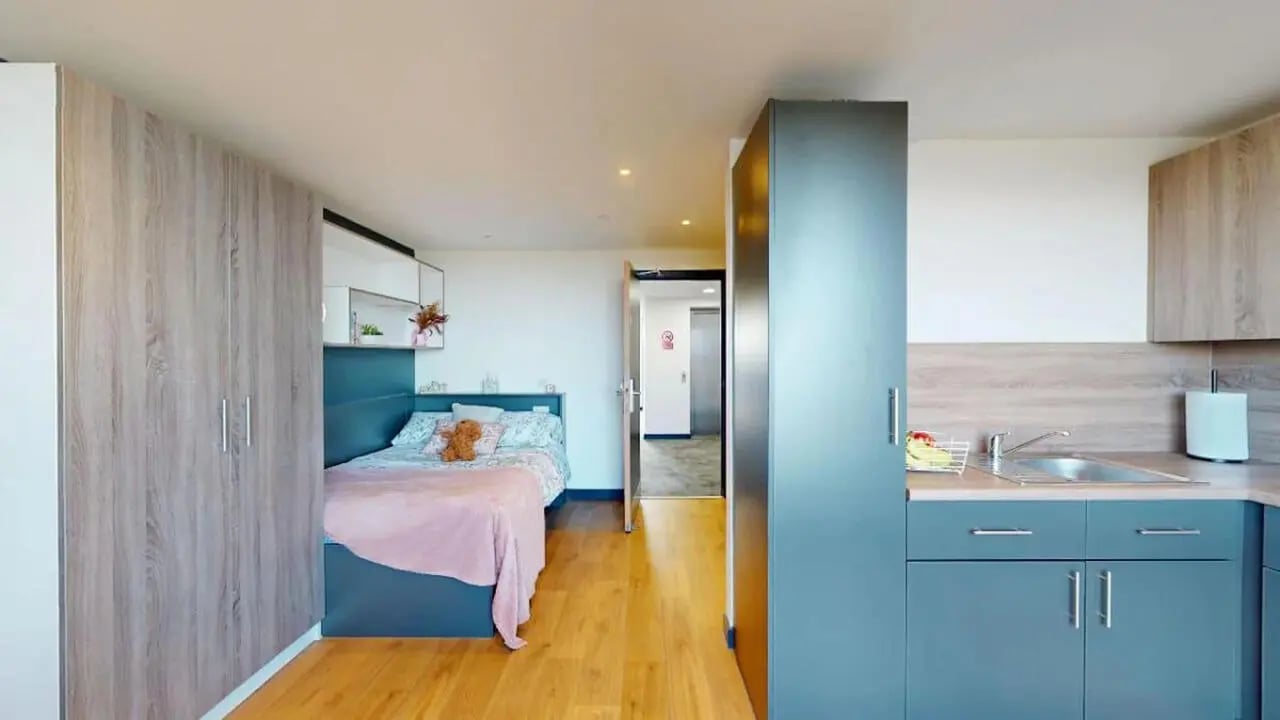 Bed kitchen cupboards and sink studio apartment at Innovo House in Liverpool Student Accommodation