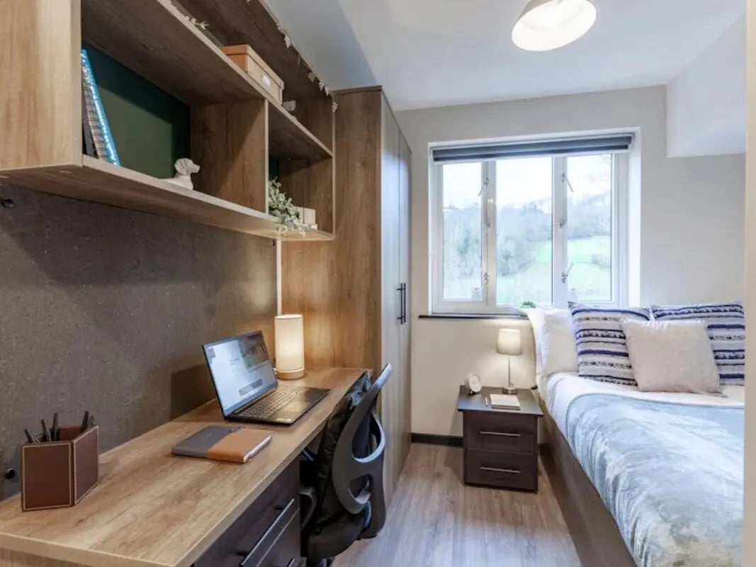 Desk laptop shelf bed and window bedroom at The Leather Works in Leeds Student Accommodation