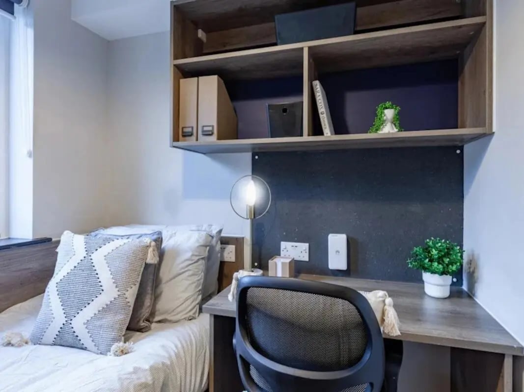 Bed desk chair and shelves student bedroom at The Leather Works in Leeds Student Accommodation