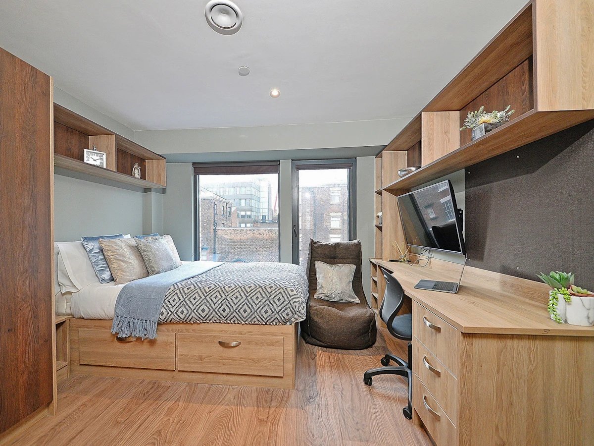 Bed desk chair beanbag and shelves bedroom at Fontenoy Apartments in Liverpool Student Accommodation