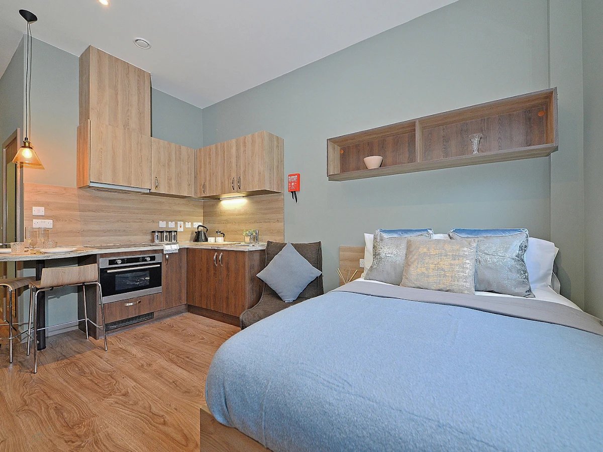 Bed kitchen area with dining table Bedroom study area at Fontenoy Apartments in Liverpool Student Accommodation
