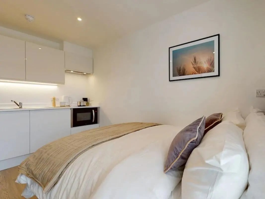 Bed kitchenette microwave artwork bedroom at One London Road in Newcastle Under Lyme Student Accommodation