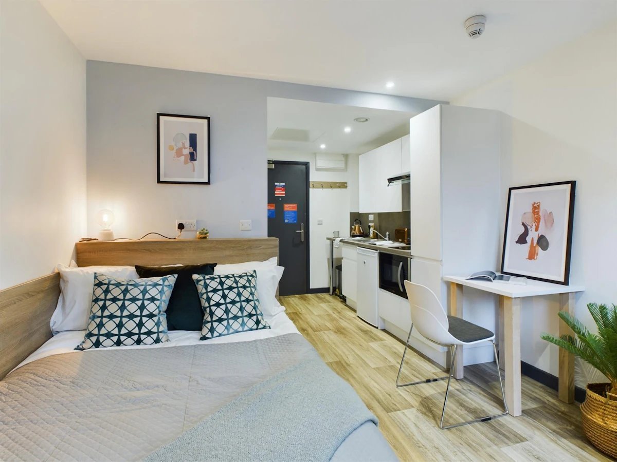 Bed kitchen area desk and chair studio at Eden Square in Coventry Student Accommodation