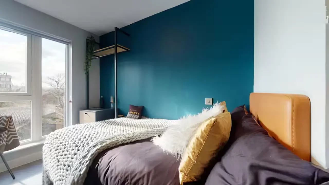 Bed with pillows and blanket bedroom at Guilden Village in Guildford Student Accommodation