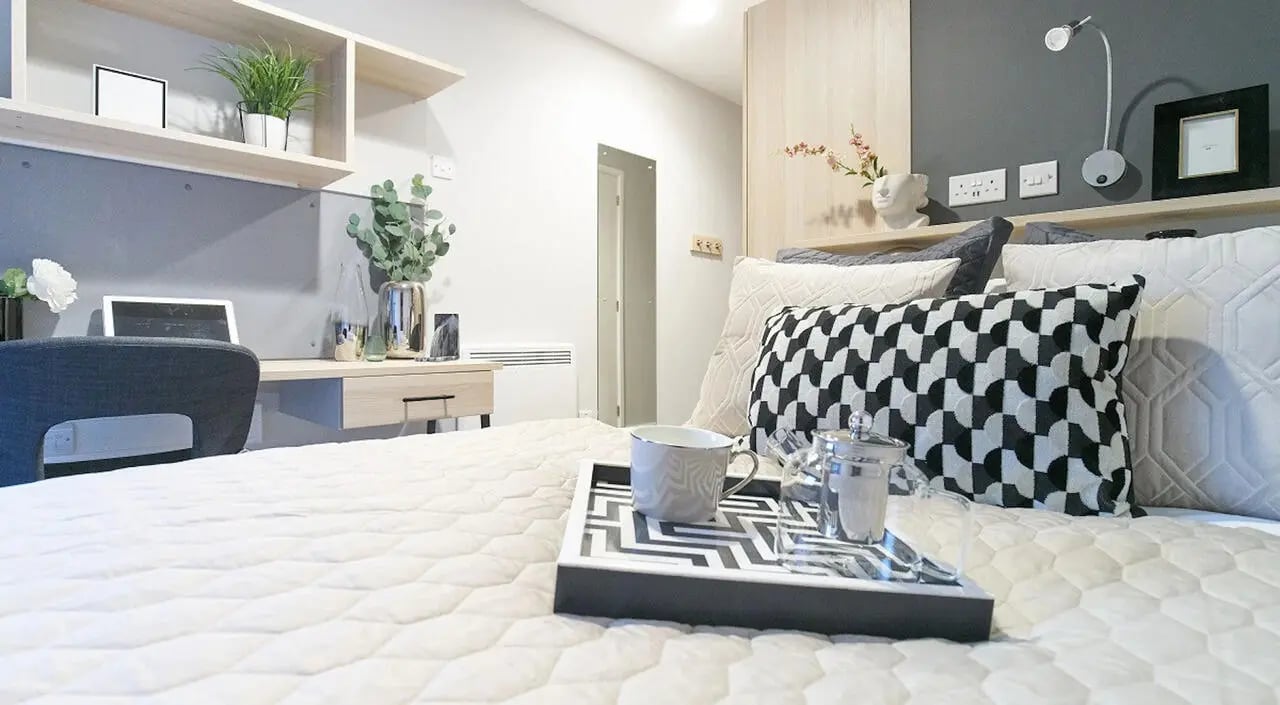 Bed with tray desk and chair bedroom at Straits Manor in Sheffield Student Accommodation
