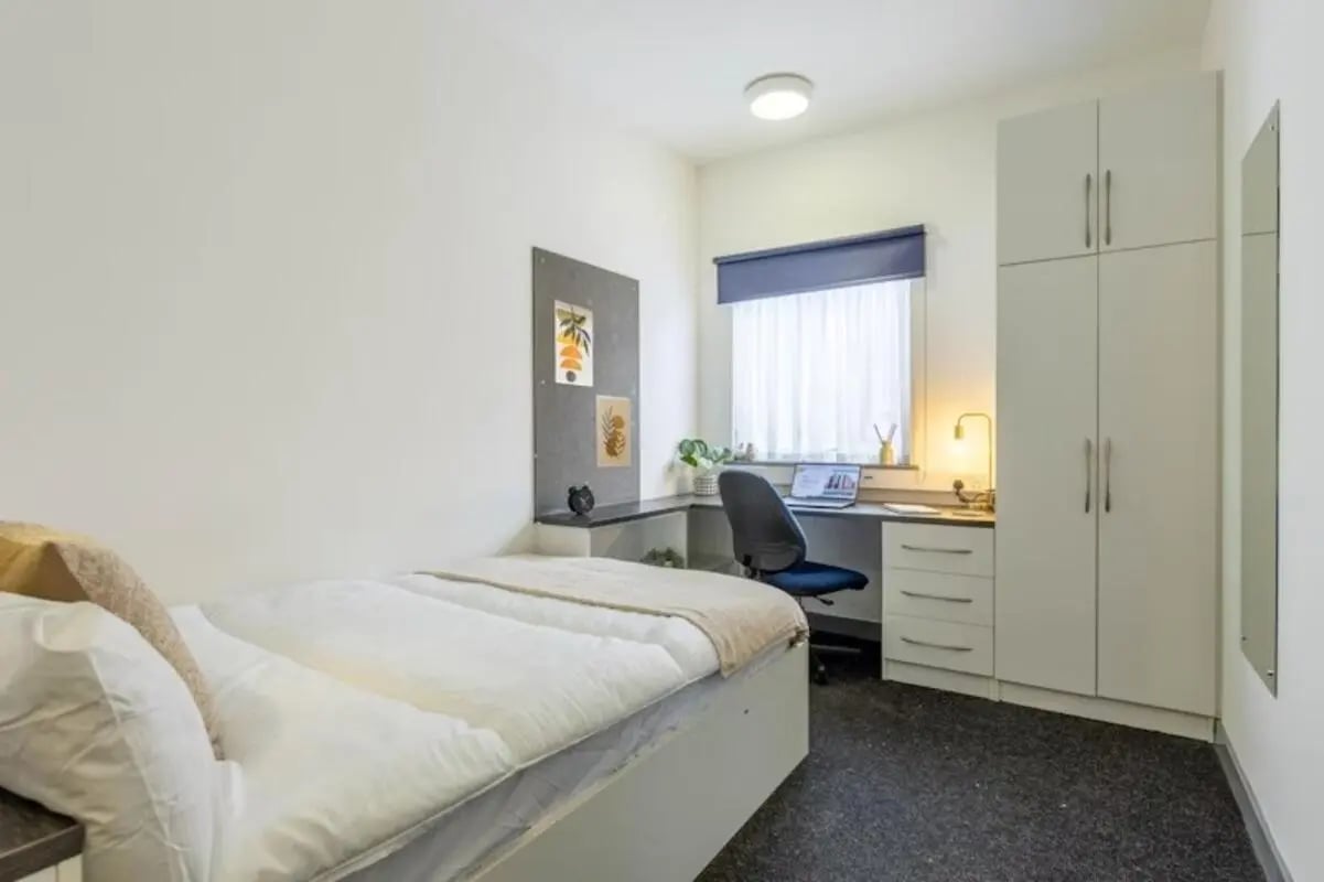 Bed desk chair wardrobe window bedroom at Russell View in Nottingham Student Accommodation