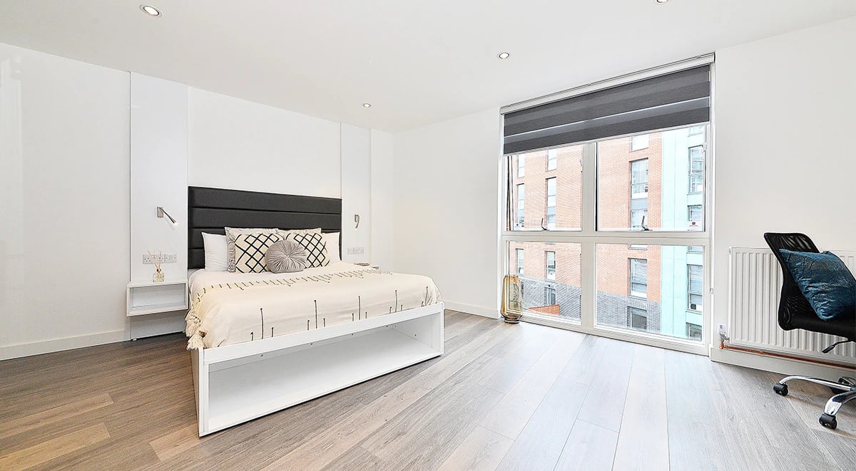 Bed with headboard bedside table chair Bedroom at Miura in Nottingham Student Accommodation