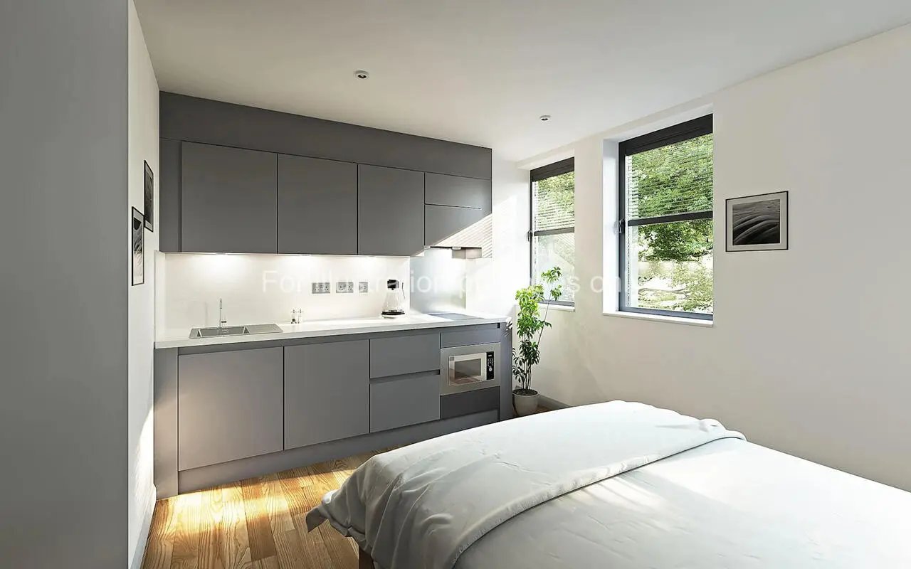 Modern grey kitchen with bed and window studio at Headrow Court in Leeds Student Accommodation