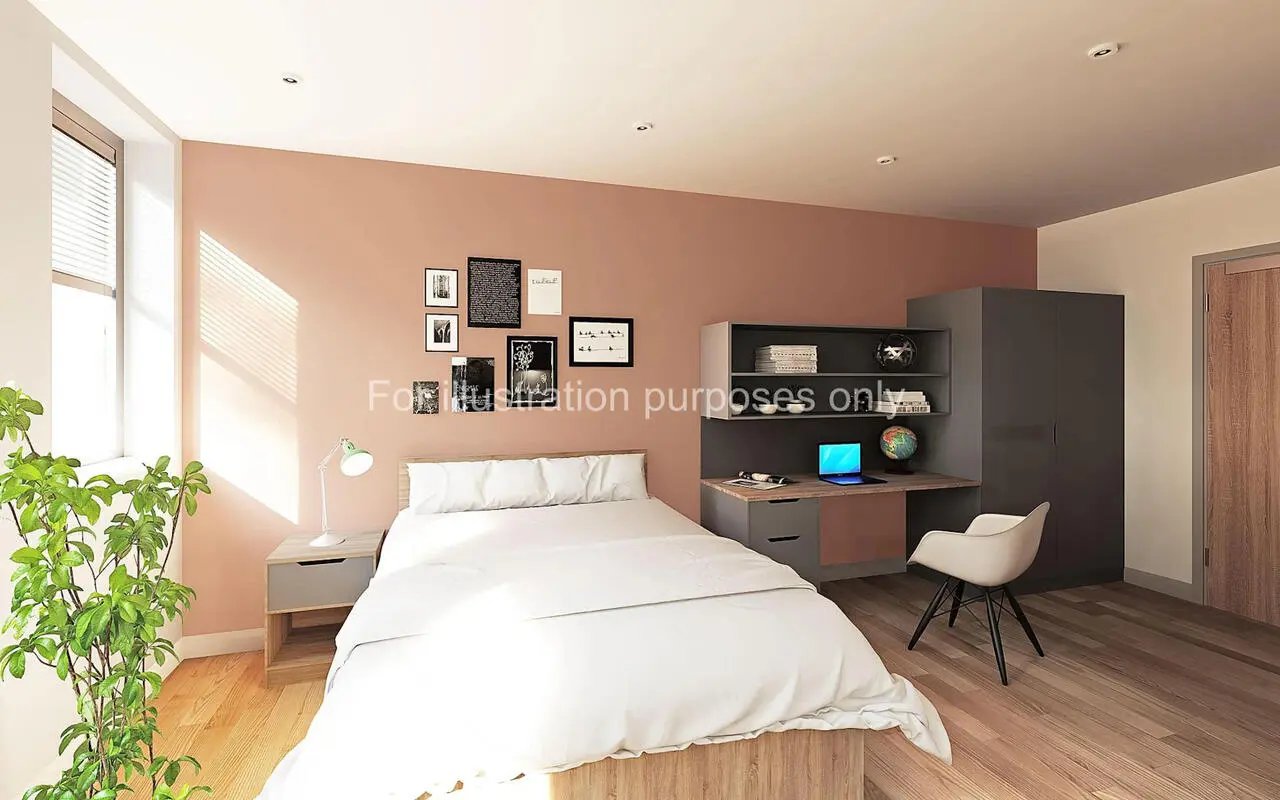 Bed desk wardrobe and chair student bedroom at Headrow Court in Leeds Student Accommodation