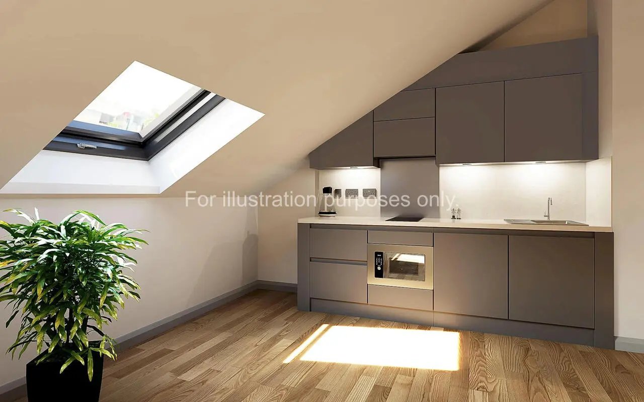 Modern gray cabinets microwave sink kitchen area at Headrow Court in Leeds Student Accommodation
