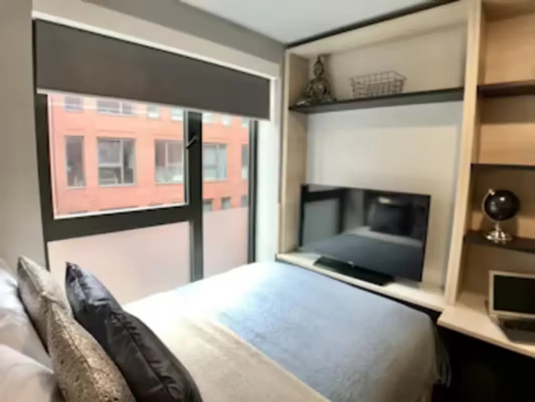 Bed TV desk and window Bedroom at Steel City in Sheffield Student Accommodation