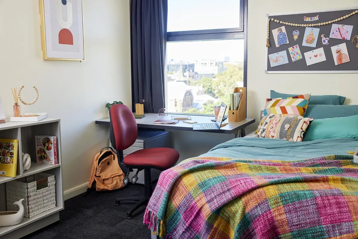 Bed desk chair backpack art decor bedroom at Broadway x Scape in Sydney Student Accommodation