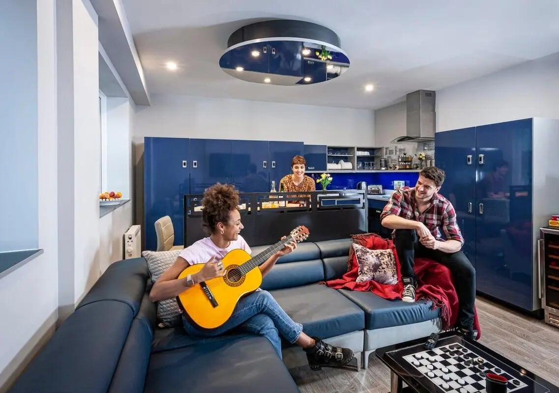 Guitar playing on sofa with friends kitchen living room at Study Inn Loughborough - Lemyngton Street in Loughborough Student Accommodation