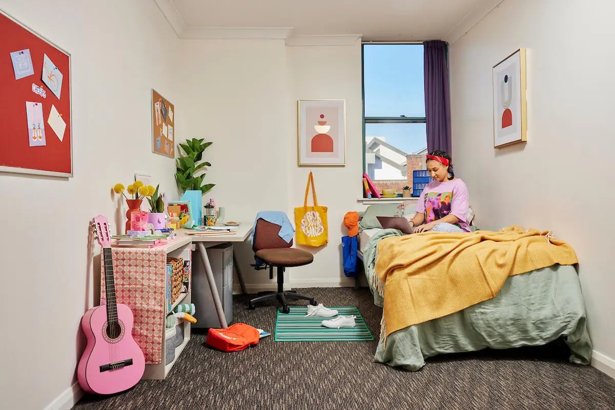 Guitar desk chair bed with student working bedroom at Mountain x Scape in Sydney Student Accommodation