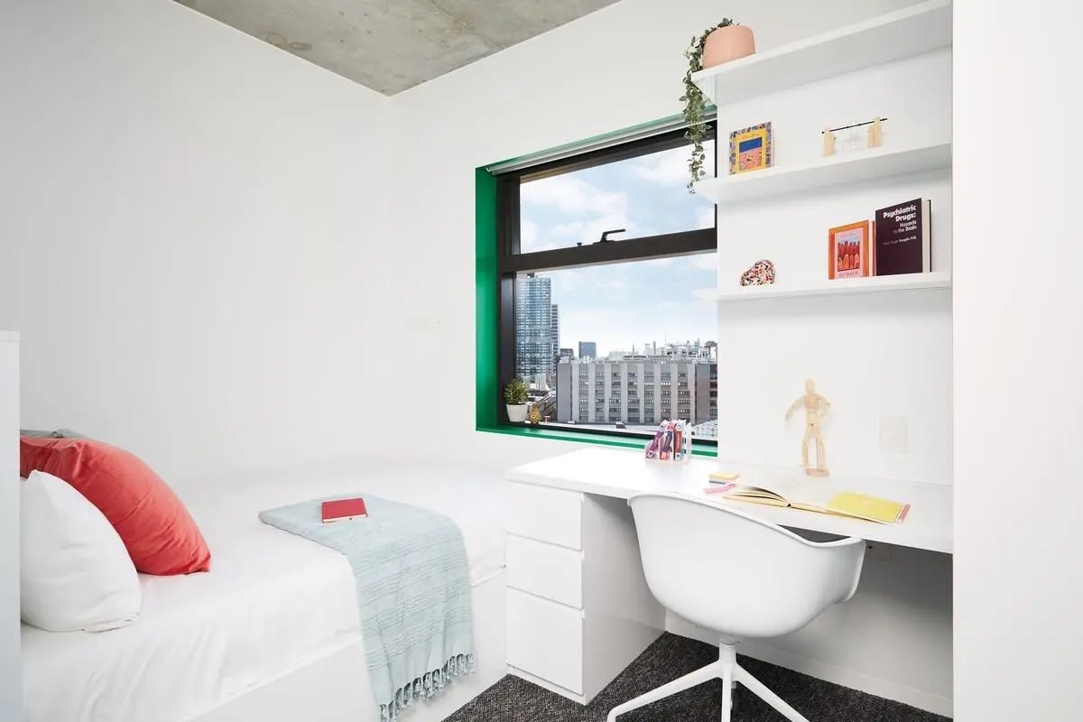 Bed study desk white chair window view bedroom at Scape Carlton in Melbourne Student Accommodation