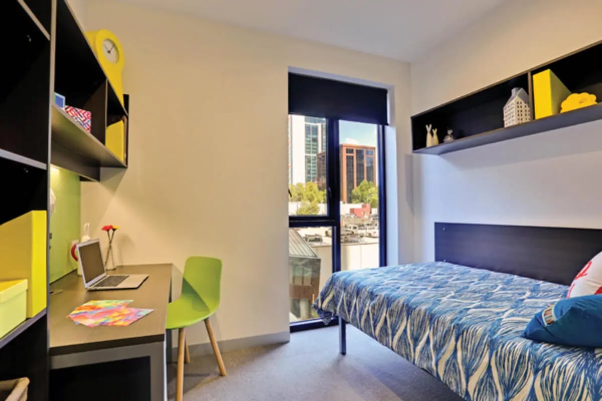 Desk bed shelves and chair bedroom at Scape Melbourne Central in Melbourne Student Accommodation