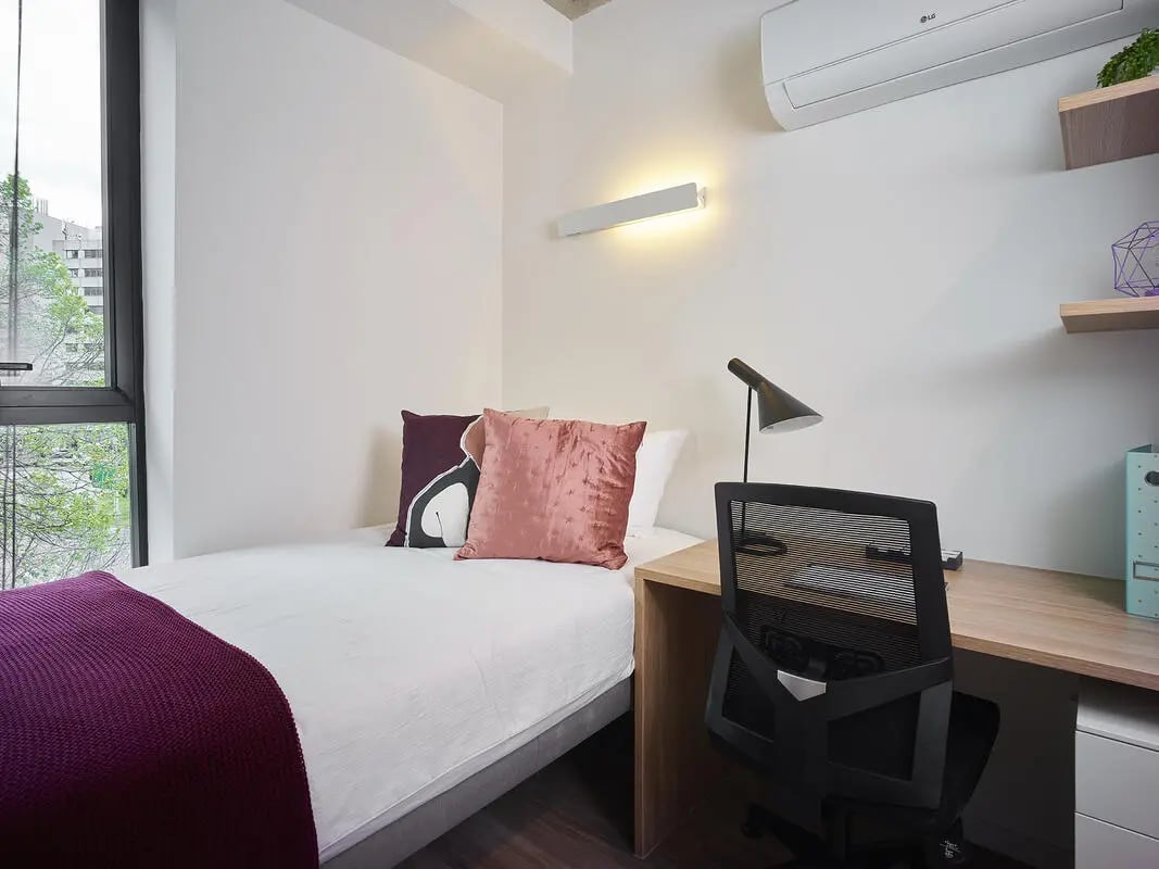 Bed desk chair pillows lamp study area at Scape Peel in Melbourne Student Accommodation