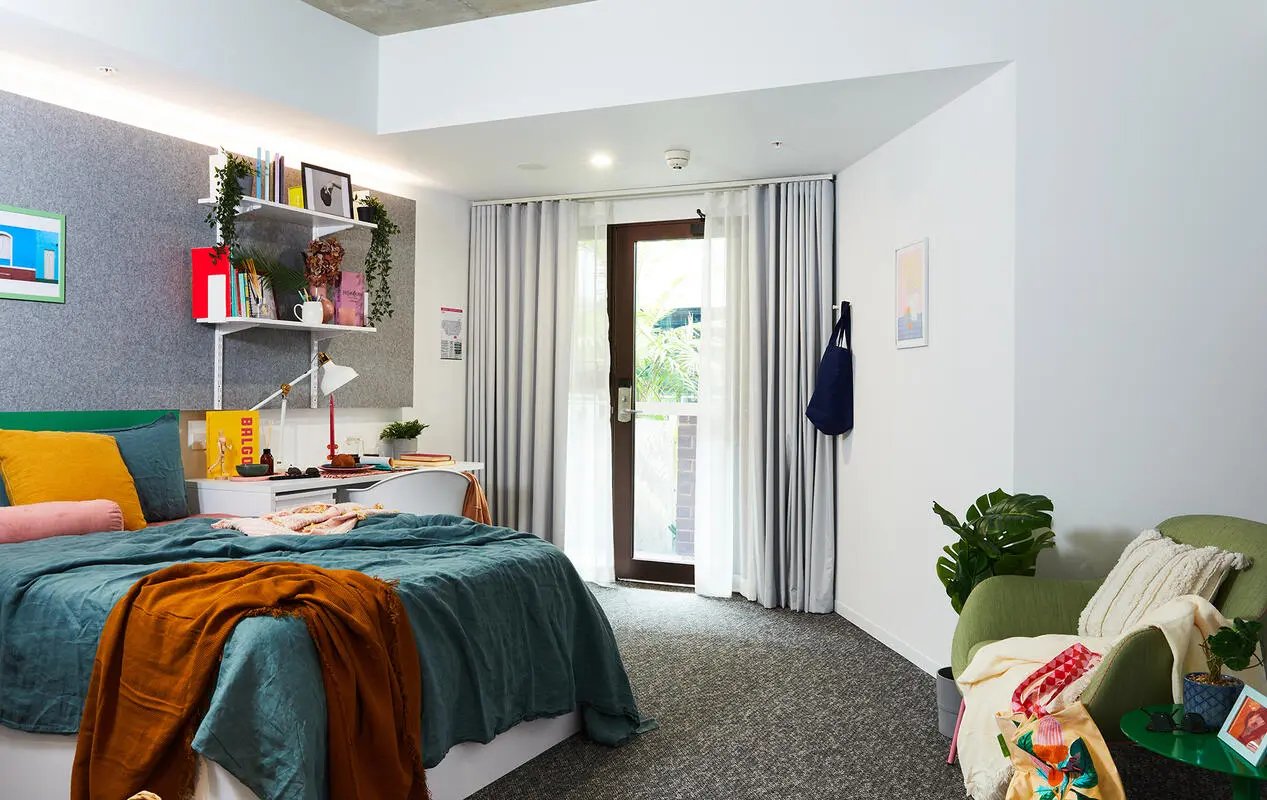 Bed desk shelves and chair student accommodation bedroom at Scape Darlington in Sydney Student Accommodation