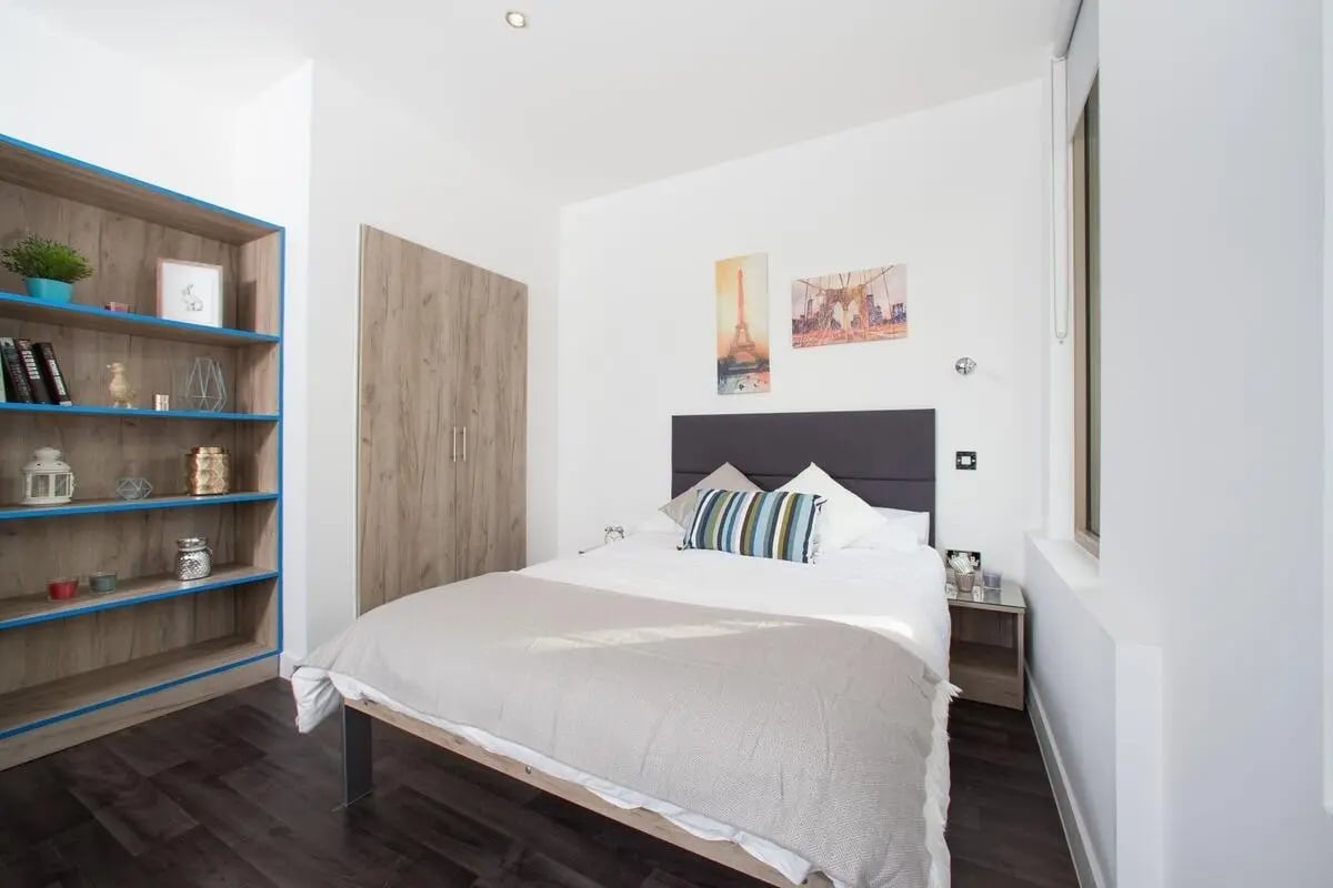 Bed bookshelf wardrobe art bedroom at Northgate Point in Chester Student Accommodation