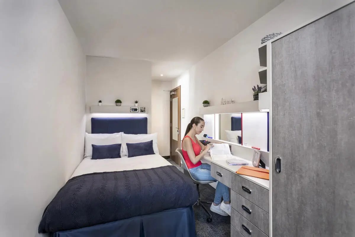 Bed desk mirror and wardrobe bedroom at Brotherton House in Leeds Student Accommodation