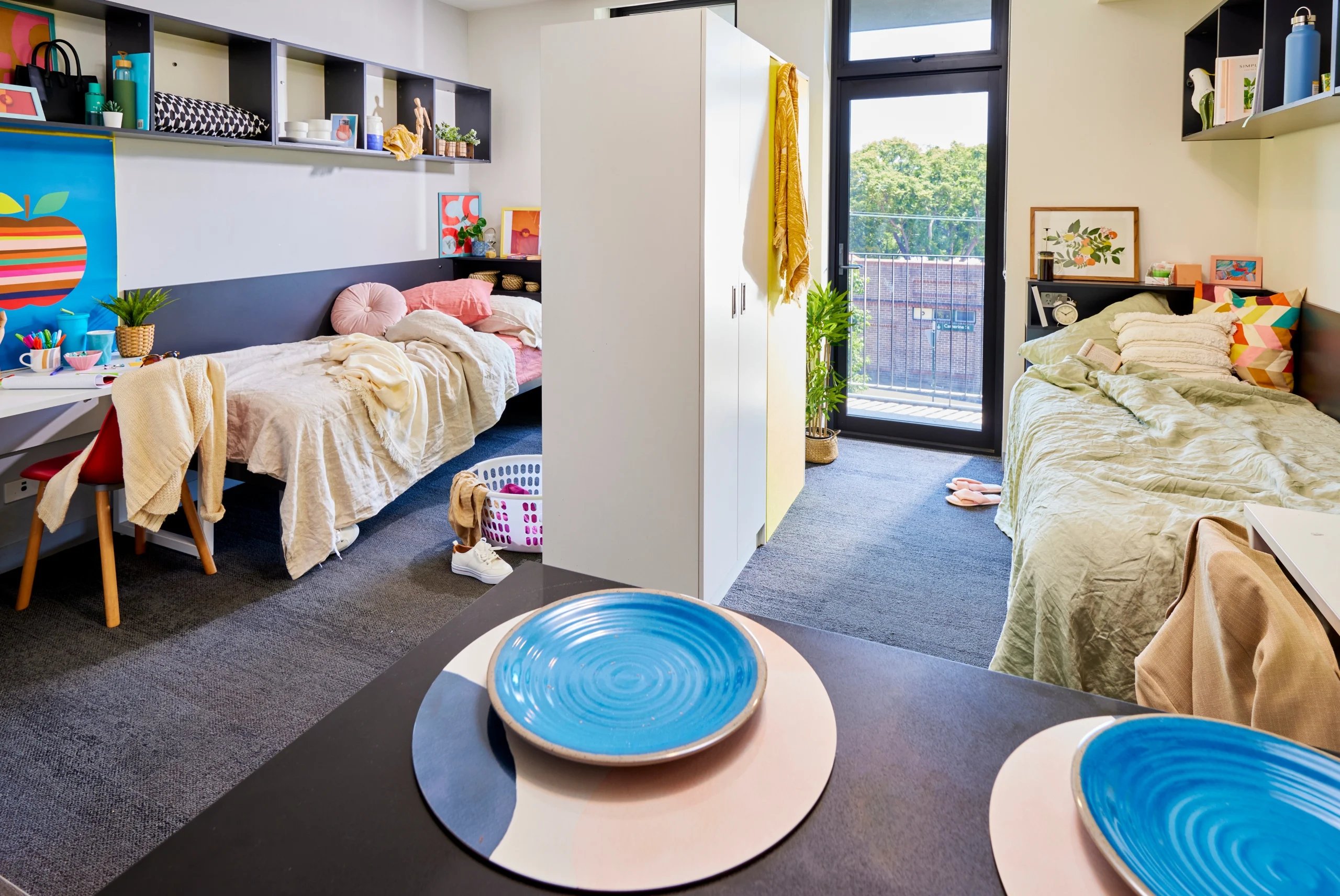 Two beds wardrobe plants and artwork bedroom at Scape Glebe in Sydney Student Accommodation
