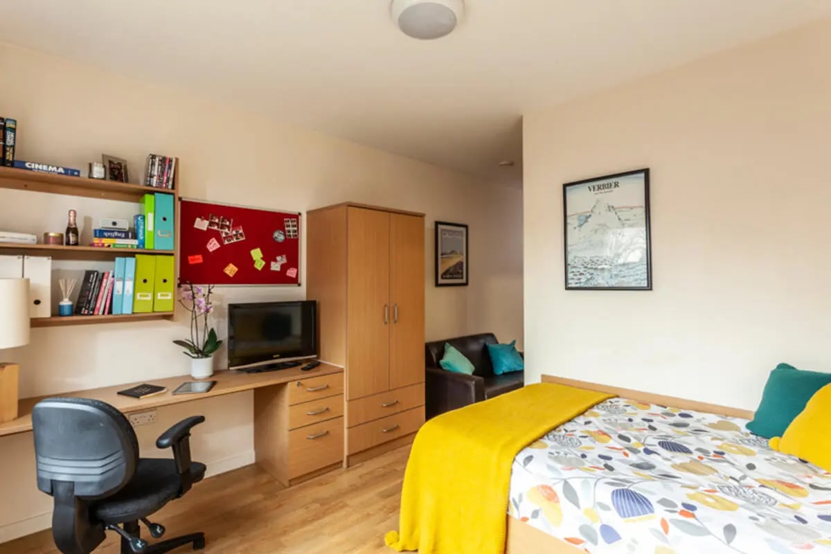Desk bed wardrobe chair and sofa bedroom at Metchley Hall in Birmingham Student Accommodation