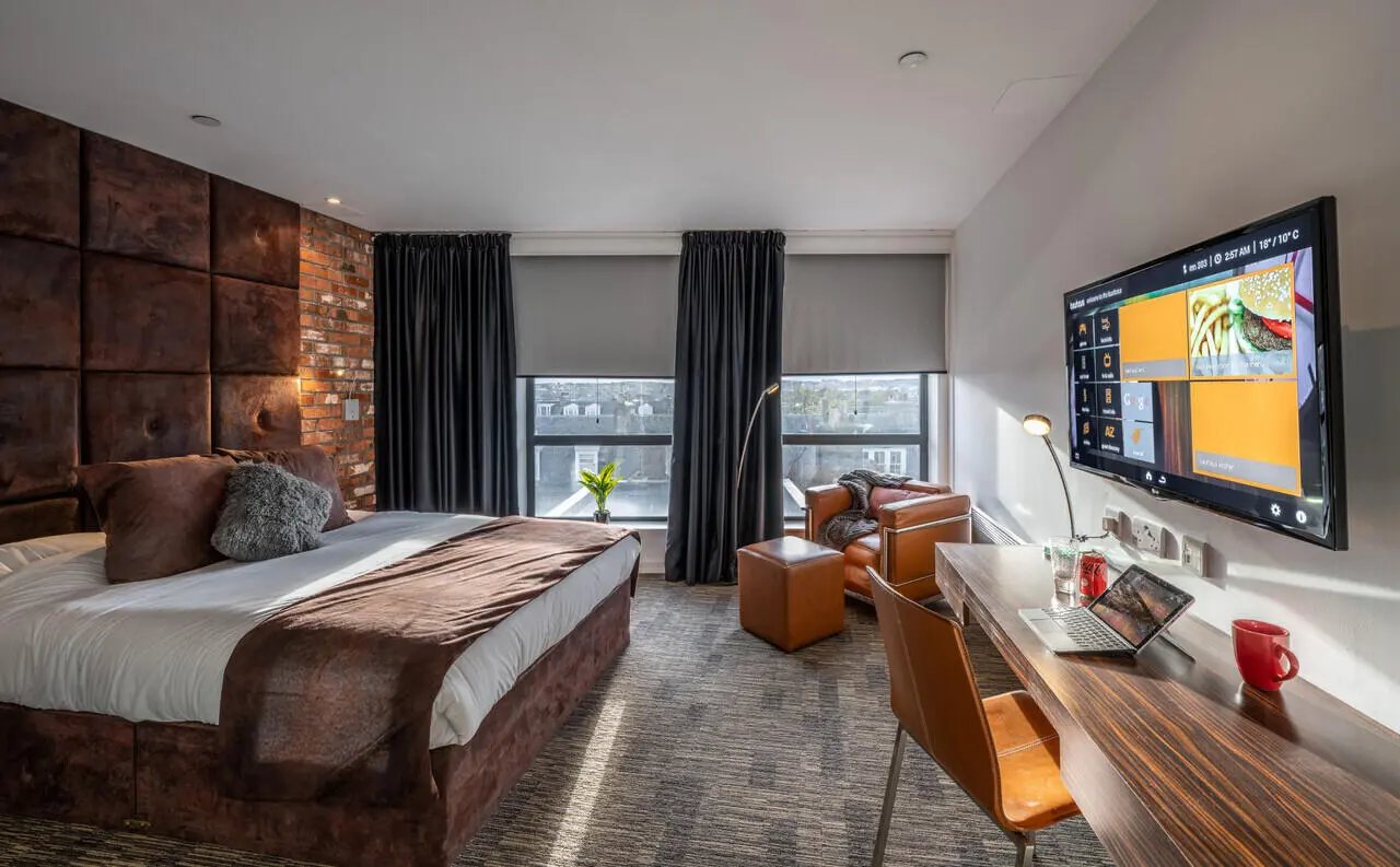 Bed desk chair TV leather chair Bedroom at Bauhaus Student Langstane Place in Aberdeen Student Accommodation