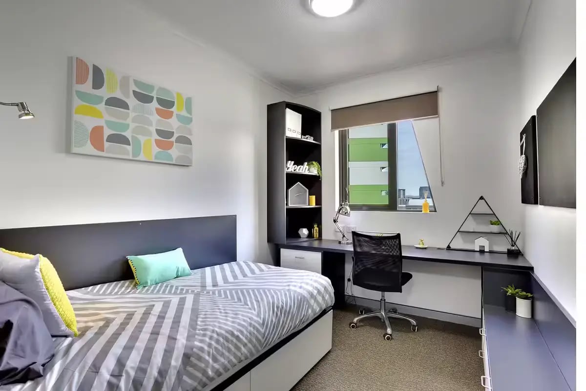 Bed desk shelving and artwork bedroom at Scape Tribune in Brisbane Student Accommodation