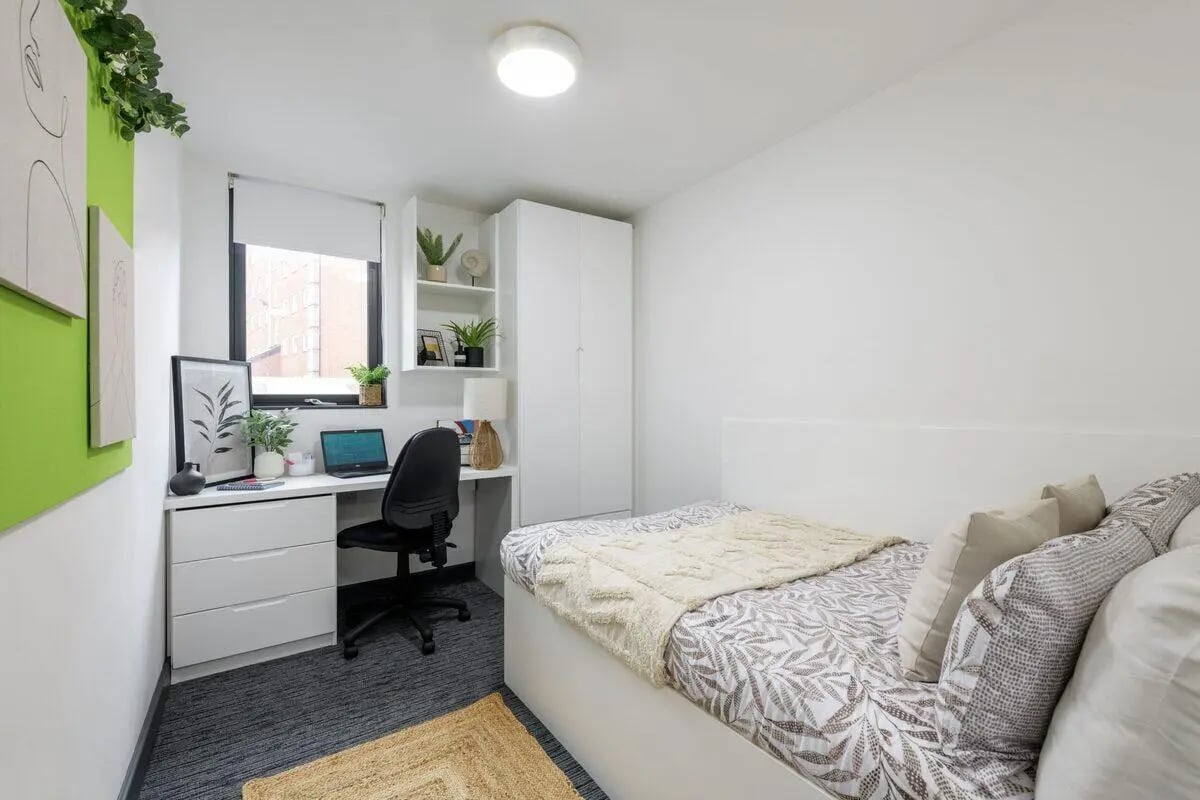 Bed desk chair wardrobe plants bedroom at Glassworks - Liverpool in Liverpool Student Accommodation