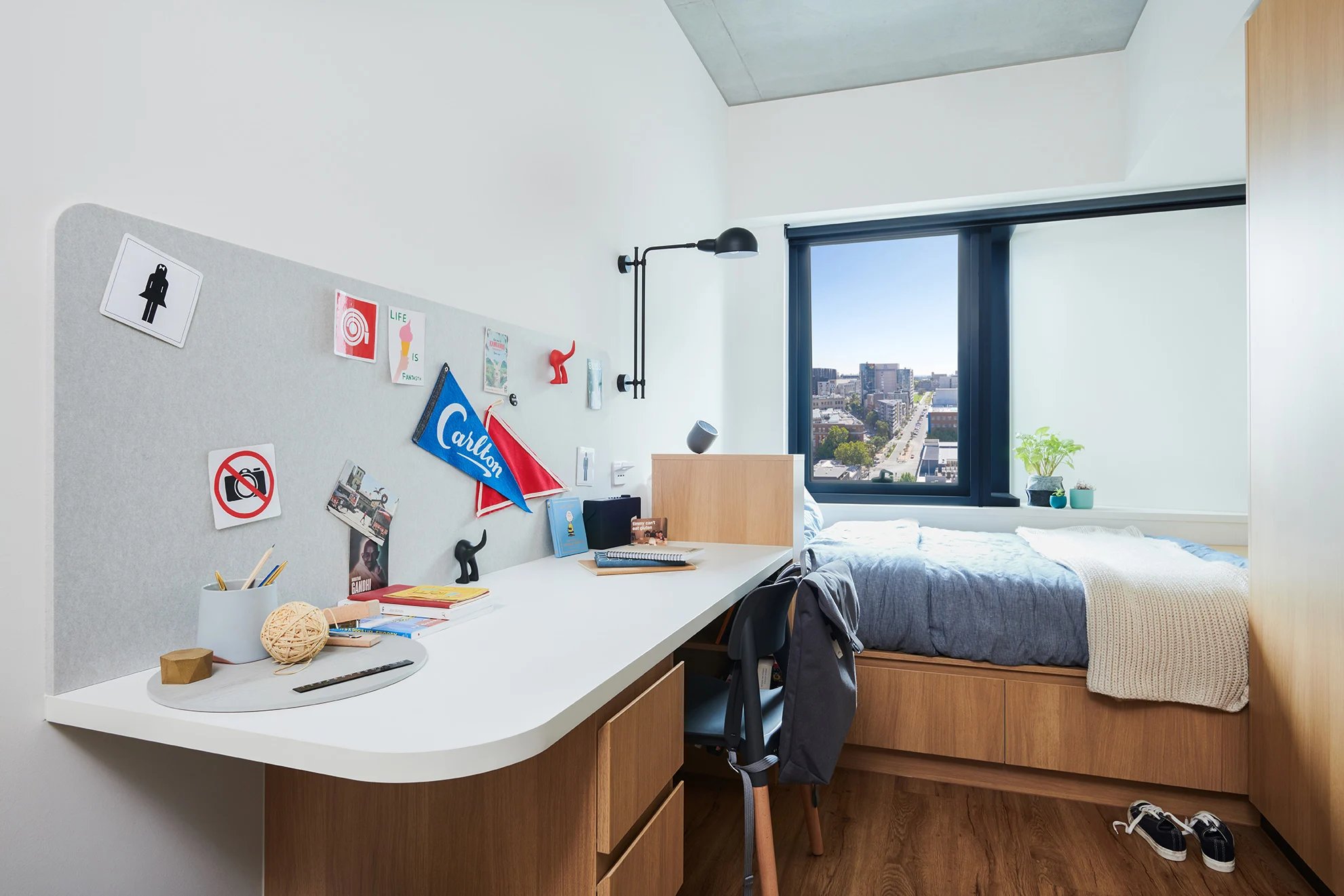 Desk bed and window view student accommodation bedroom at Scape Uni Square in Melbourne Student Accommodation