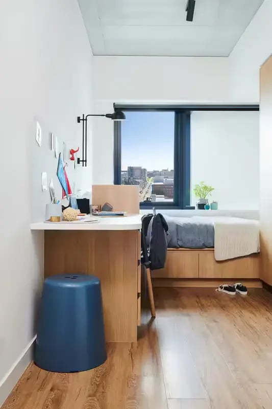 Desk bed stool window backpack bedroom at Scape Uni Square in Melbourne Student Accommodation