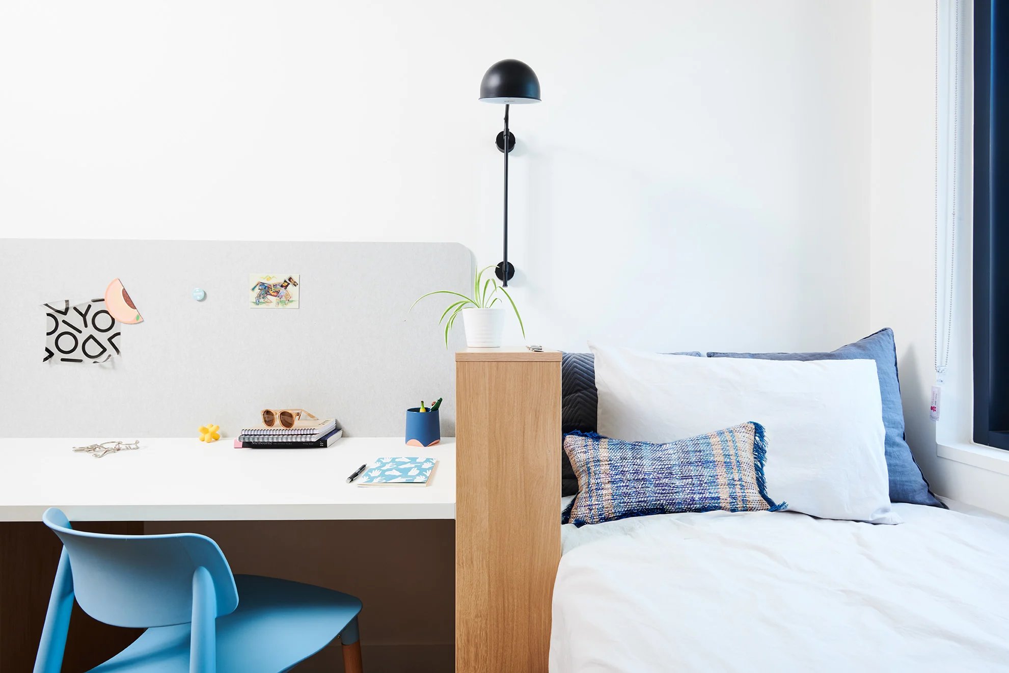 Desk chair plant and bed study area at Scape Uni Square in Melbourne Student Accommodation