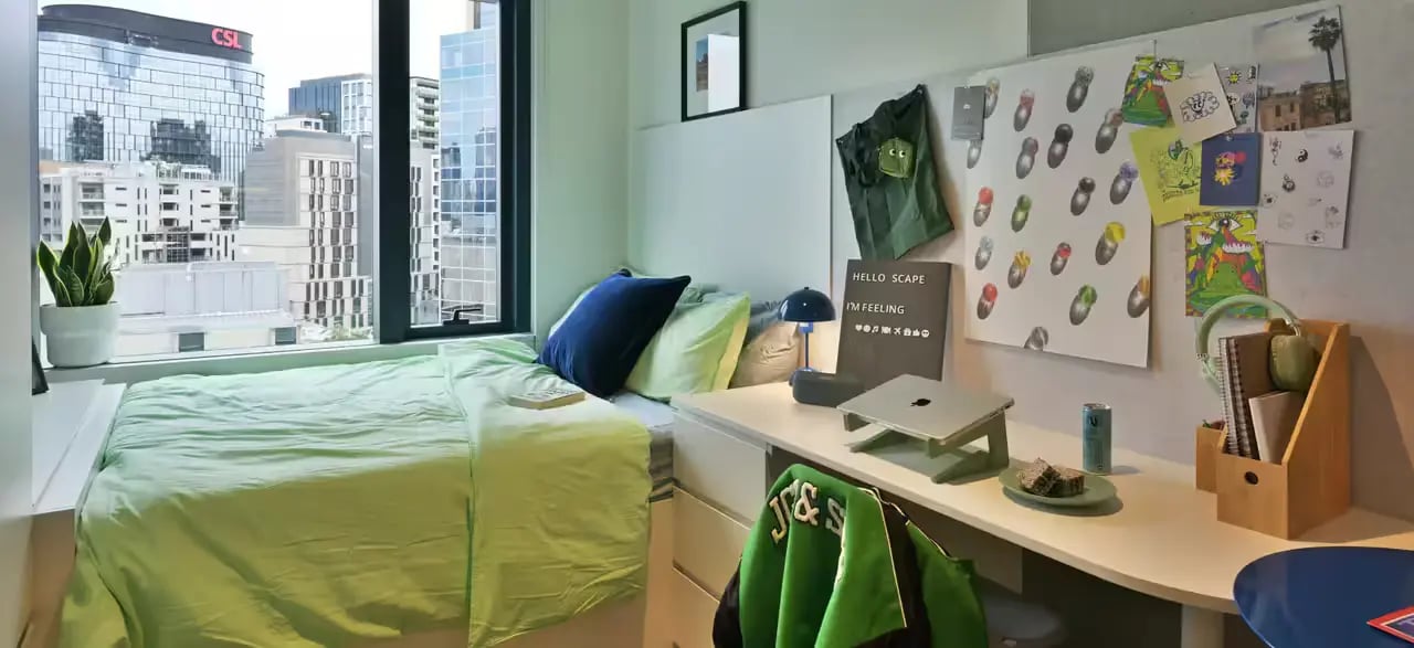 Bed desk laptop and city view bedroom at Scape Leicester in Melbourne Student Accommodation