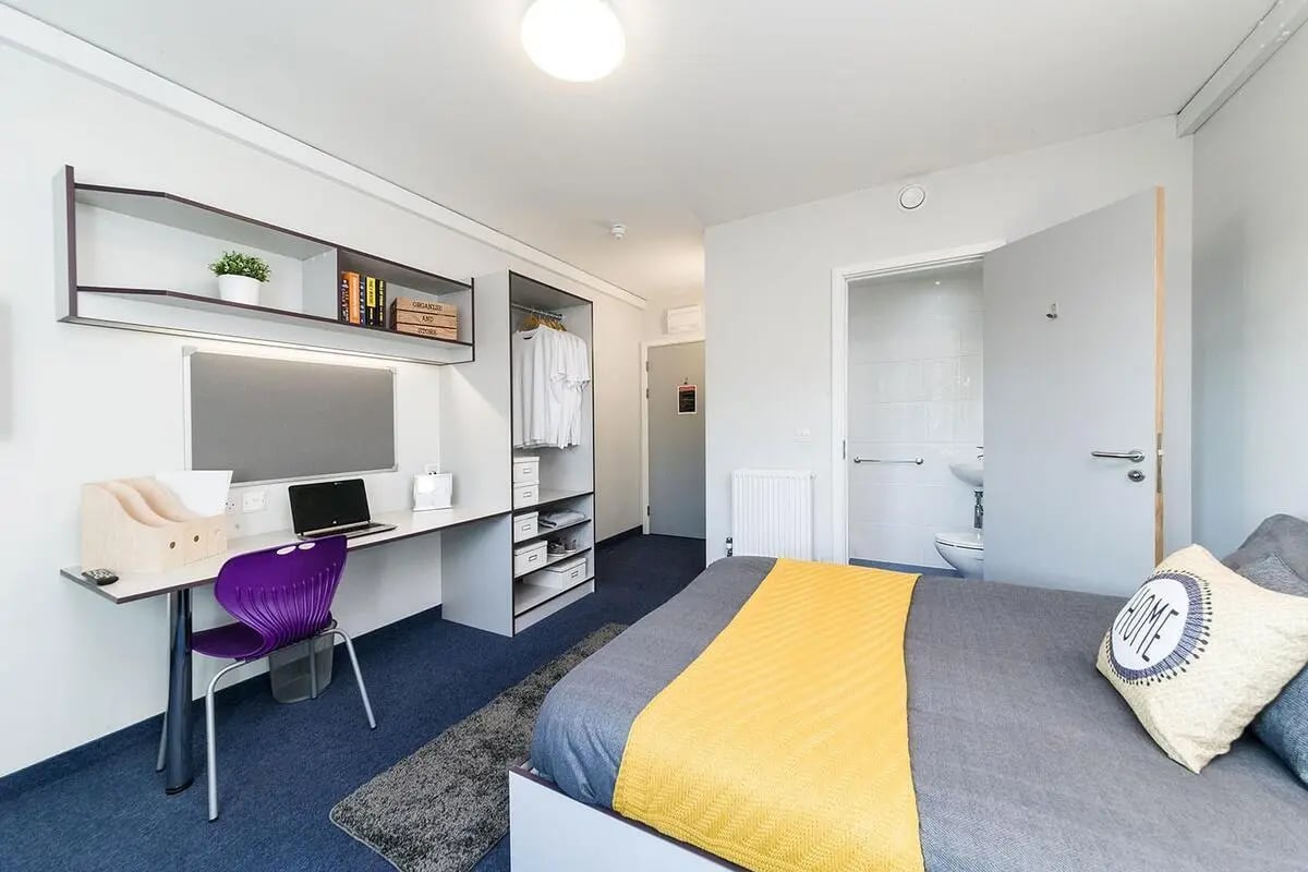 Desk chair bed closet open bathroom bedroom at Quayside Court in Newcastle Upon Tyne Student Accommodation