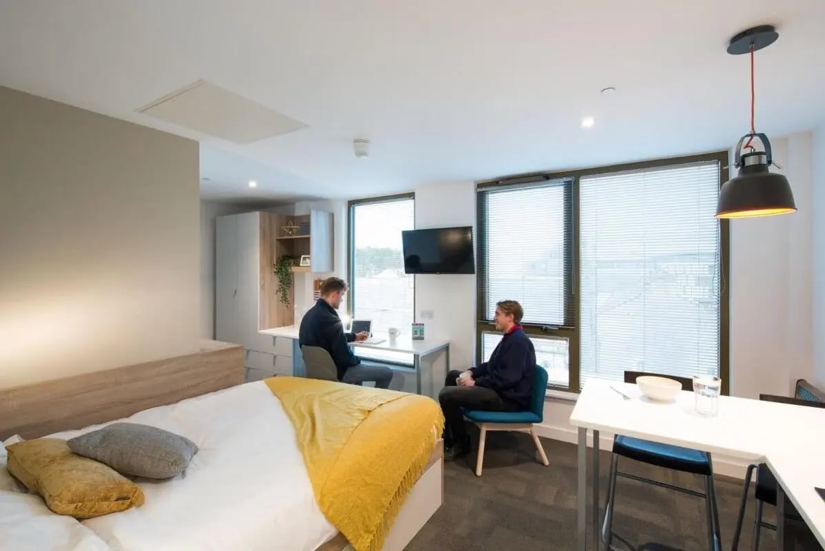 Bed desk and two people study area at CityBlock Marton Street in Lancaster Student Accommodation