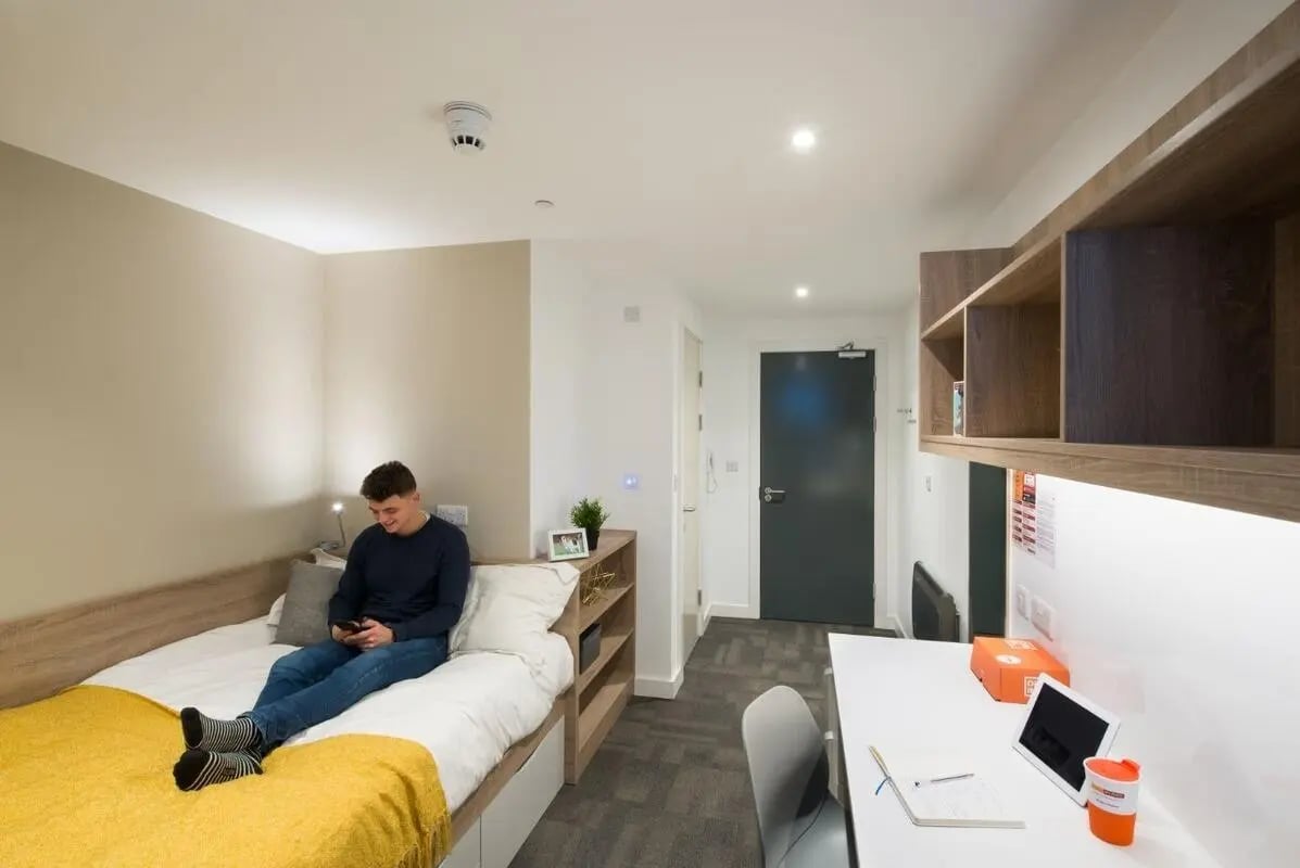 Bed desk and shelves student room at CityBlock Marton Street in Lancaster Student Accommodation