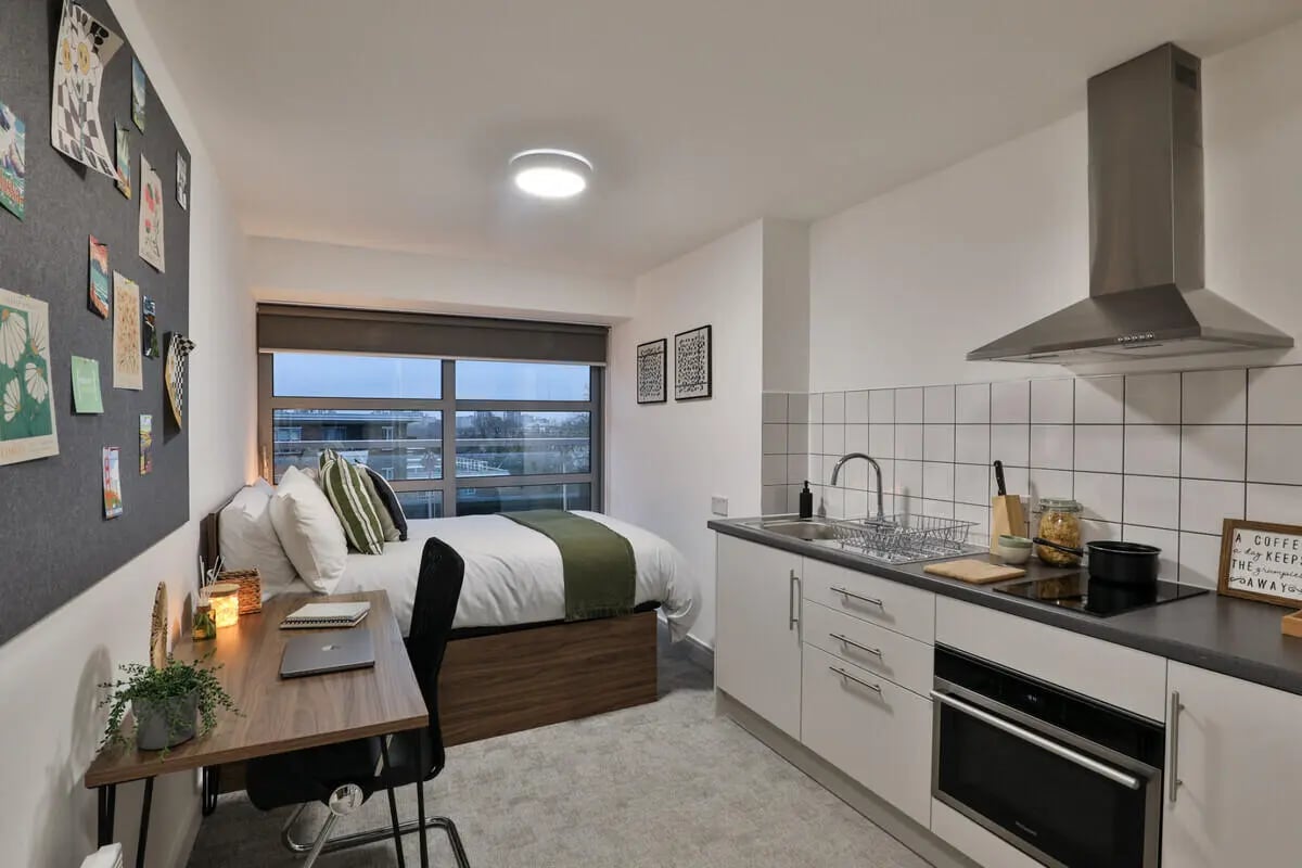 Bed desk chair kitchen studio apartment at Francis Gardner in London Student Accommodation