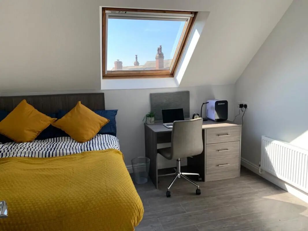 Bed desk laptop and chair bedroom at Welton Road in Leeds Student Accommodation